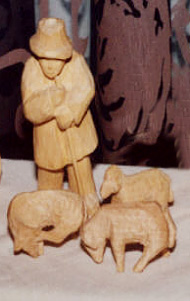Hirte mit drei Schafen